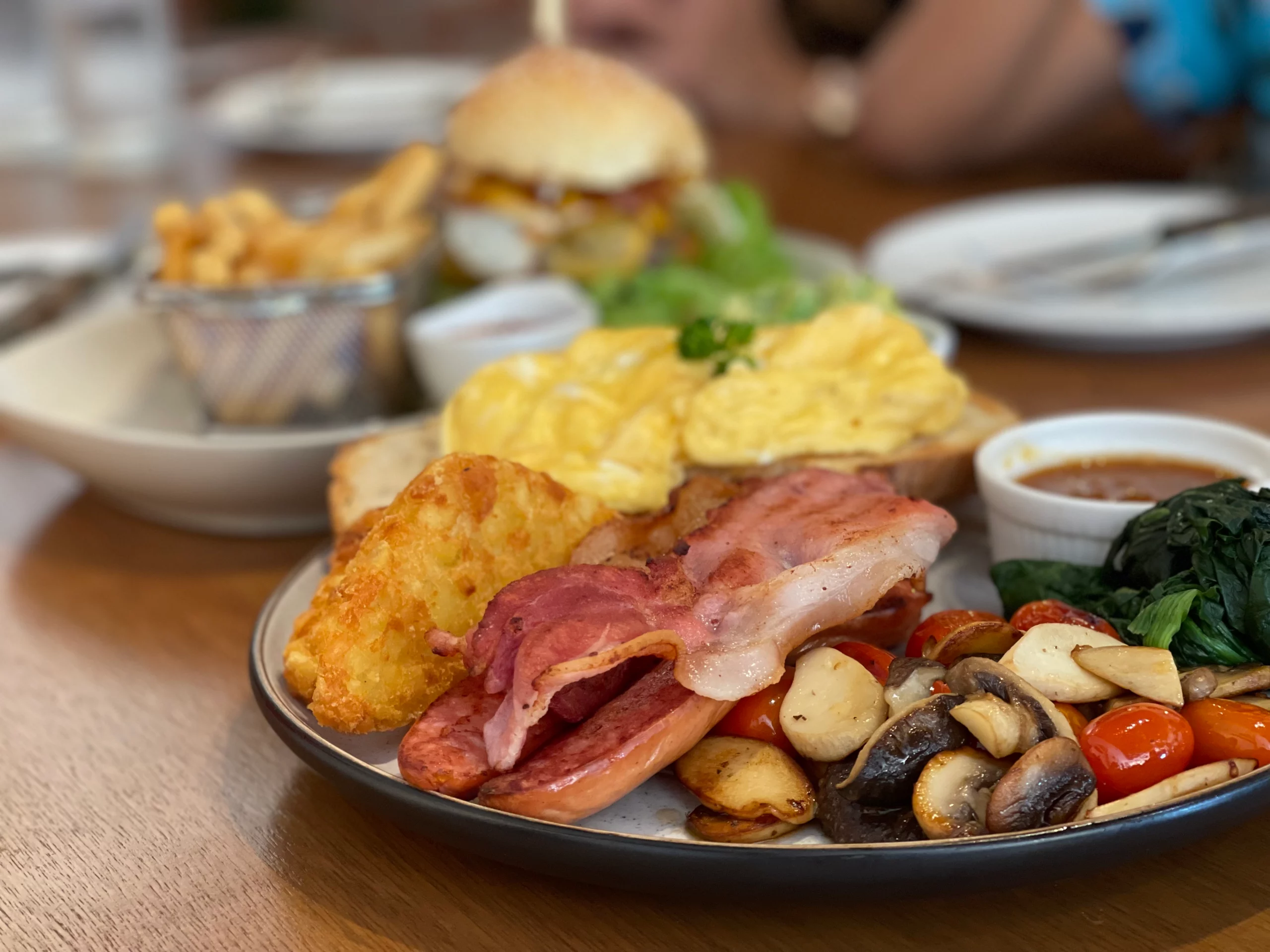 A delicious plate of crispy hash browns, perfectly cooked eggs of your choice, hash browns, sauteed mushrooms and the perfect sauce for dipping. The best breakfast in Chalong at Poached Breakfast Cafe, Chalong, Phuket, Thailand