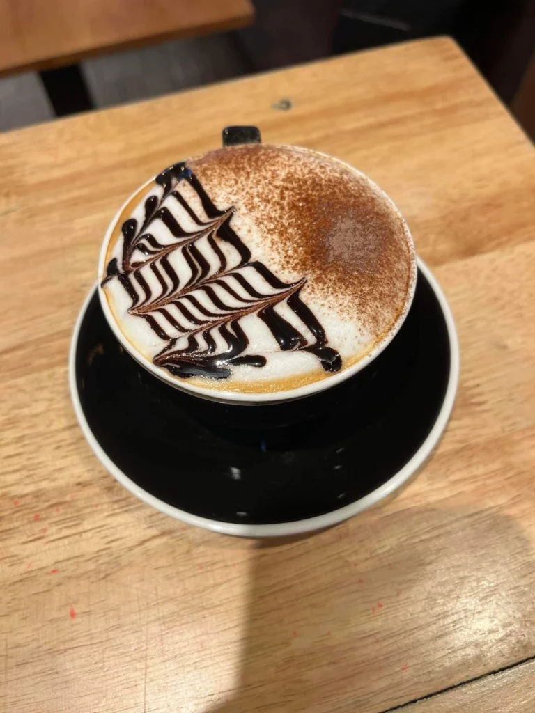 Beautiful chocolate mocha art on a coffee at the best spot for lunch in Chalong: Poached Breakfast Cafe, Chalong, Phuket, Thailand