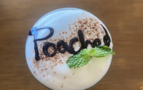 After Eight Iced Cappuccino with the word 'Poached' written in chocolate syrup. A great alternative to a hot chocolate in Chalong at Poached Breakfast Cafe, Chalong, Phuket, Thailand