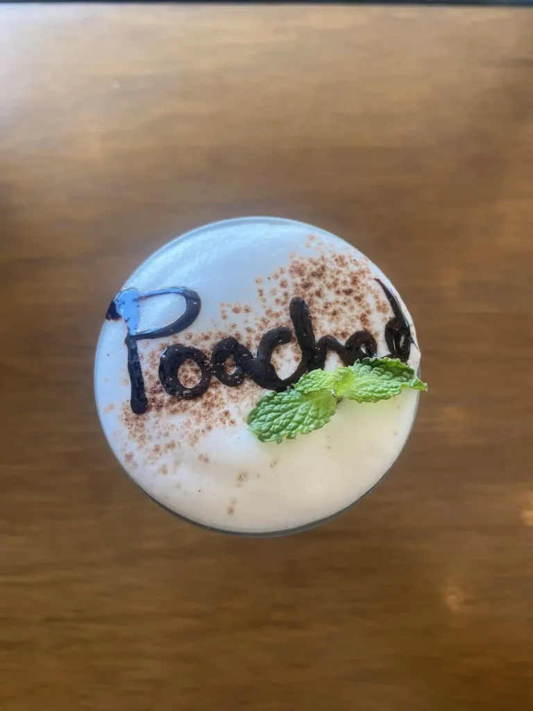 After Eight Iced Cappuccino with the word 'Poached' written in chocolate syrup. A great alternative to a hot chocolate in Chalong at Poached Breakfast Cafe, Chalong, Phuket, Thailand
