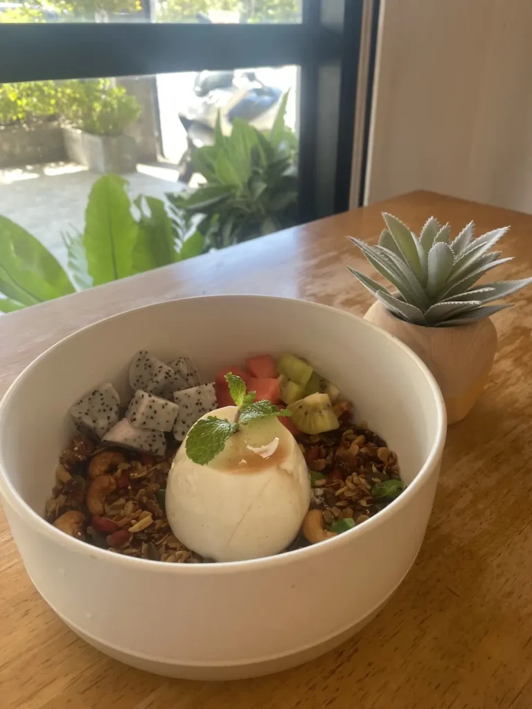 Breakfast panna cotta with granola, dragon fruit, cashews, fresh mint, caramel sauce and watermelon at the best spot for an American breakfast in Chalong: Poached Breakfast Cafe, Chalong, Phuket, Thailand