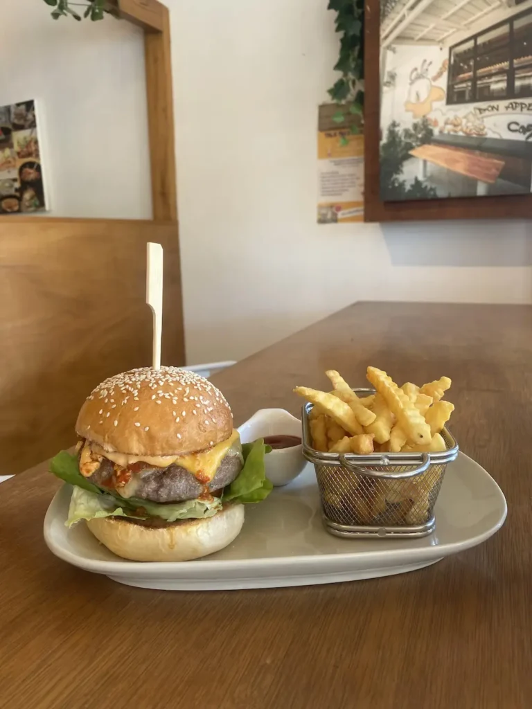 Spicy breakfast burger with fries and ketchup at the best spot for an American breakfast in Chalong: Poached Breakfast Cafe, Chalong, Phuket, Thailand