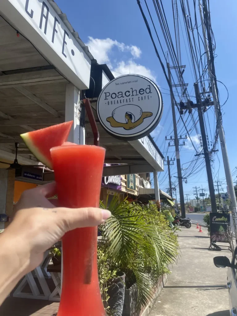 Fresh watermelon smoothie with fresh watermelon on top in front of the Poached Breakfast Cafe sign at the best bakery in Chalong: Poached Breakfast Cafe, Chalong, Phuket, Thailand