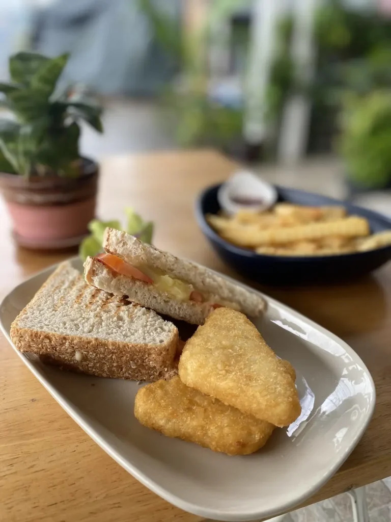 Toasted ham, cheese and tomato sandwich with hash browns and fries on the side. Add some avo for a delicious avocado breakfast in Chalong. Only at Poached Breakfast Cafe, Chalong, Phuket, Thailand