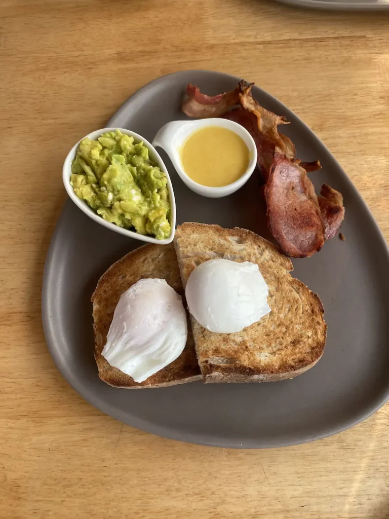 Bacon and Avo Breakfast with eggs and toast at Poached Breakfast Cafe, the best place to chow down before hitting up one of the great surf locations in Phuket.