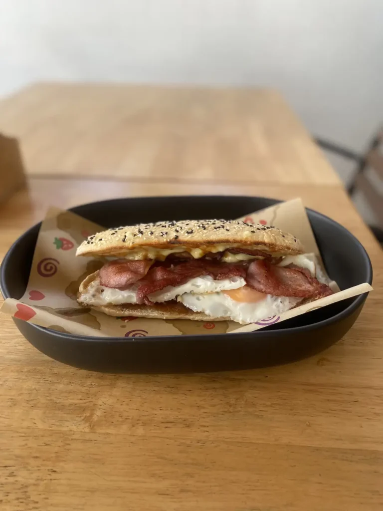 Bacon and egg sandwich on fresh bread at the best place to fuel up before a day at one of the waterparks in Phuket - Poached Breakfast Cafe, Chalong, Phuket, Thailand