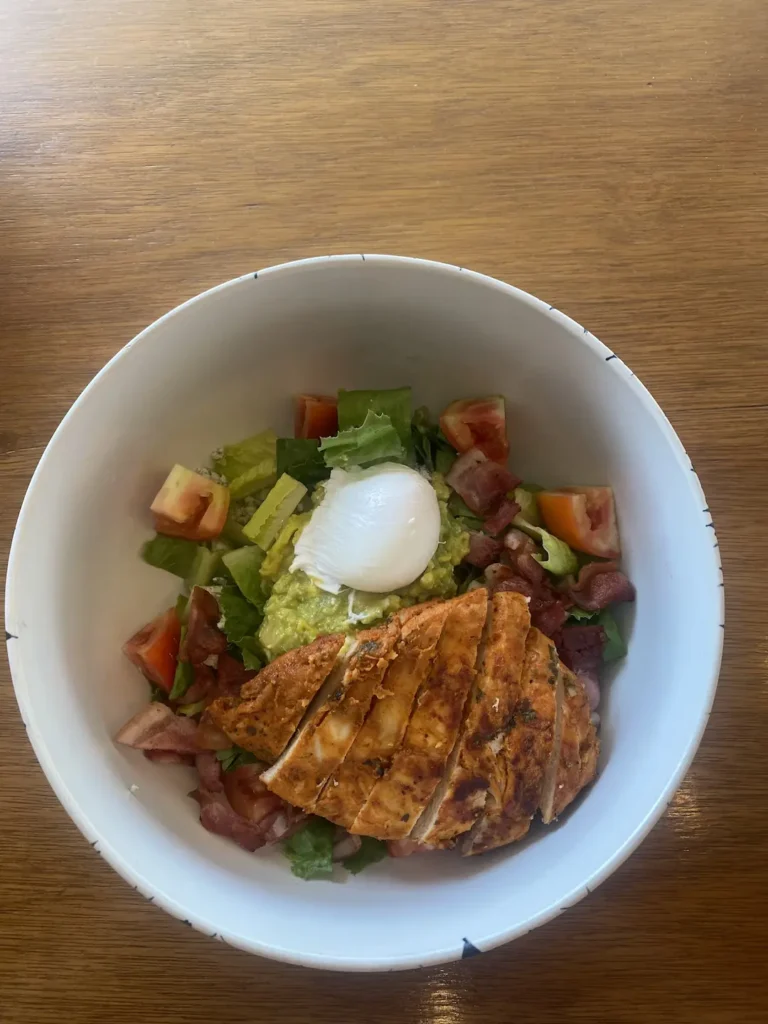 Grilled chicken cobb salad with a poached egg at one of the best indoor attractions in Phuket: at Poached Breakfast Cafe , Chalong, Phuket, Thailand