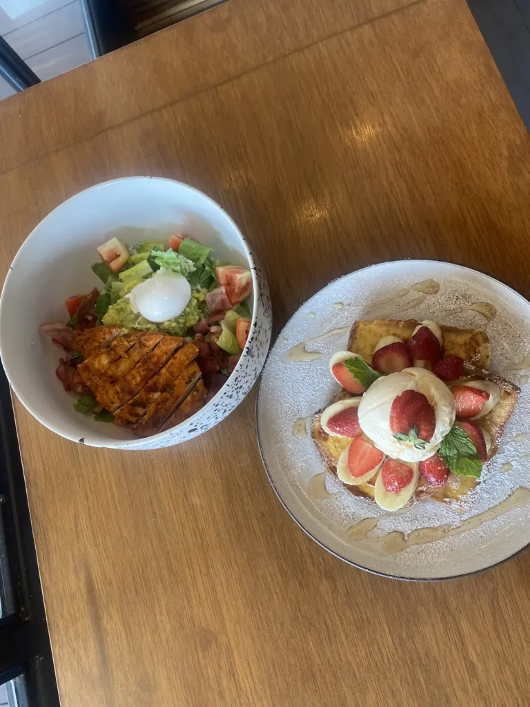 Cobb salad and french toast with strawberries, bananas and ice cream at the best place to fuel up before a day at one of the waterparks in Phuket - Poached Breakfast Cafe, Chalong, Phuket, Thailand
